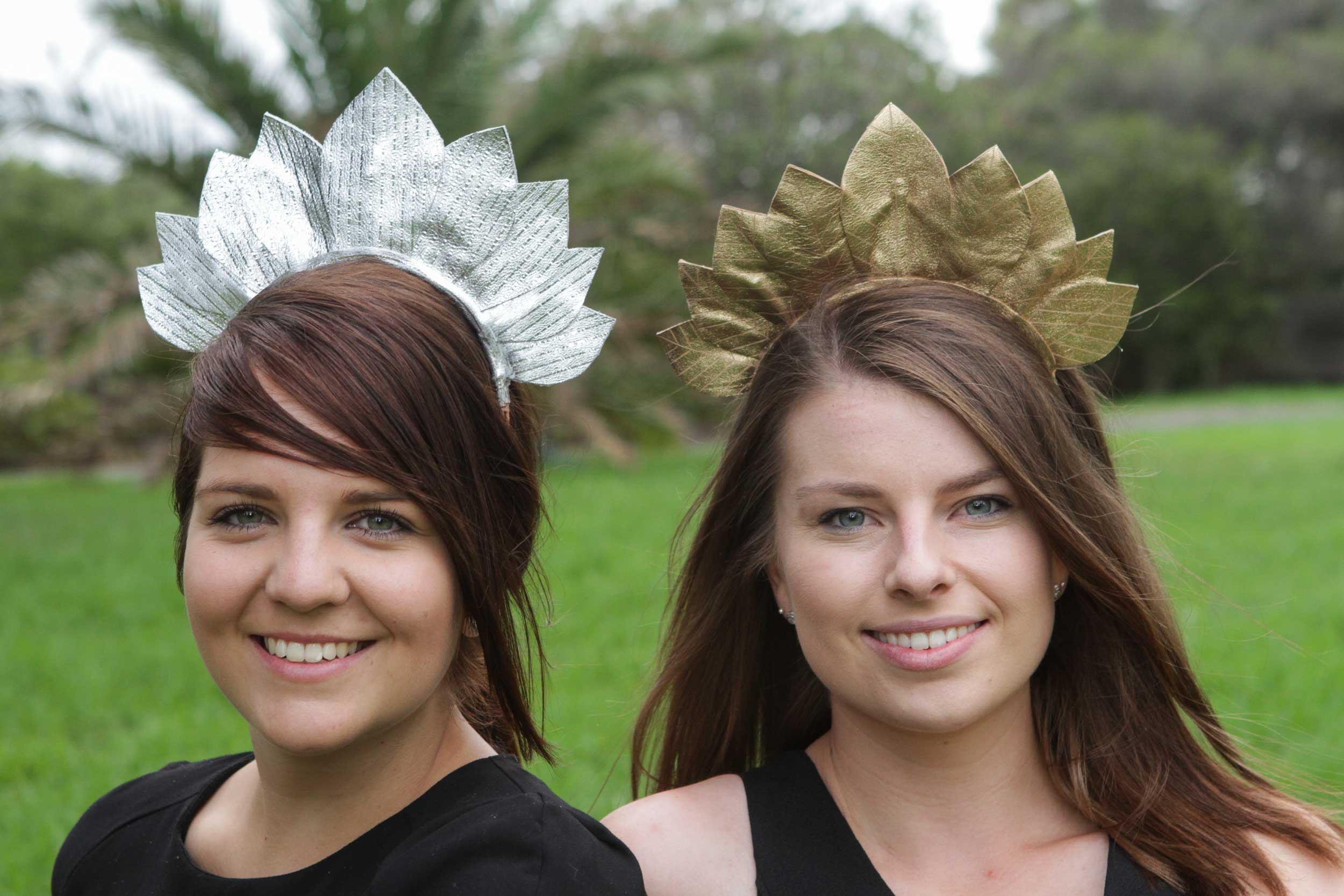 Tara-wears-a-silver-leather-leaf-design-headband-and-Hayley-wears-the-same-design-in-gold.